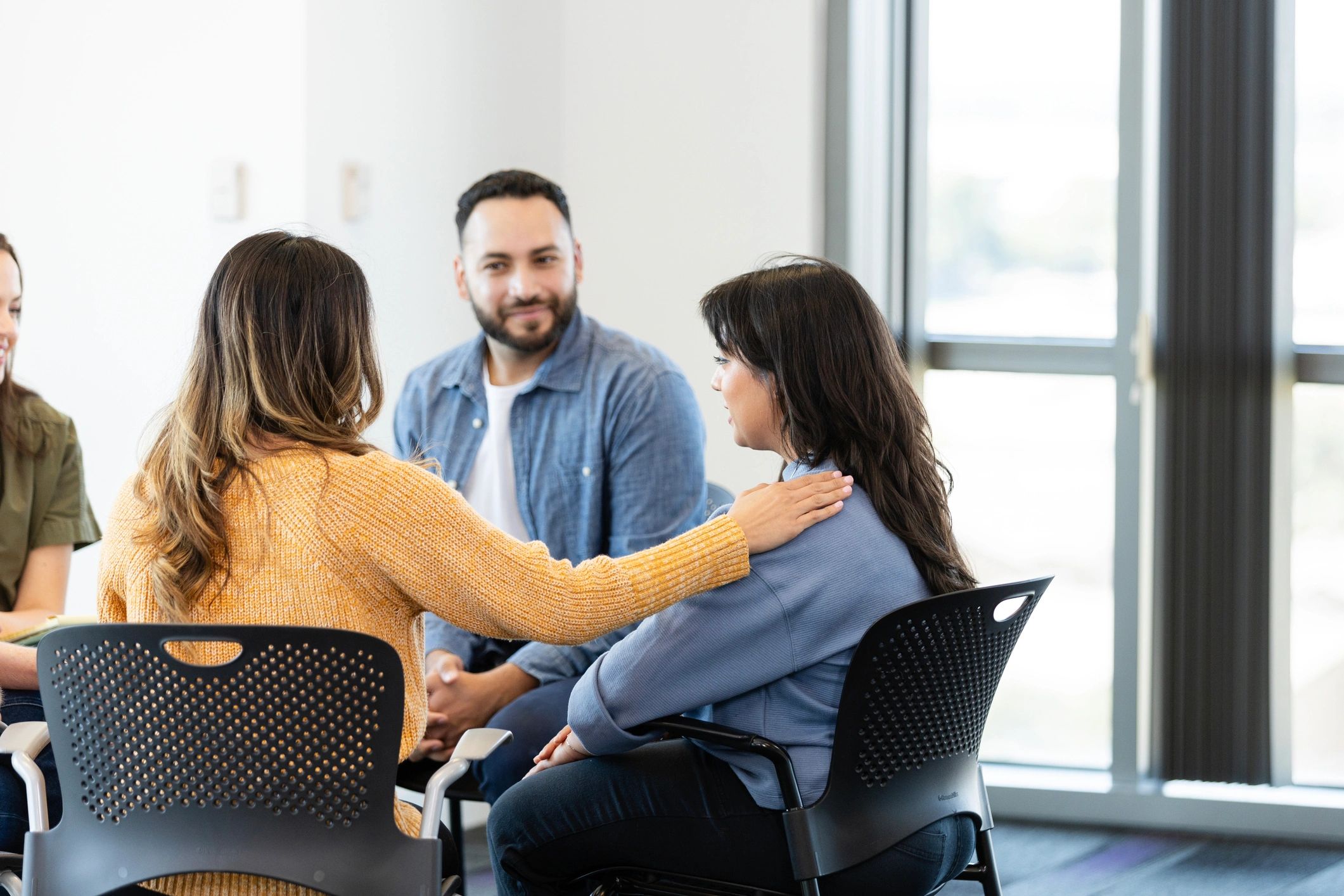 Support group moment showing comfort and connection