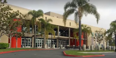 Coast Hills Church exterior building with palm trees and walkway