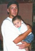 Portrait of a man holding a baby