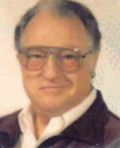 Portrait of a person with glasses and a collared shirt