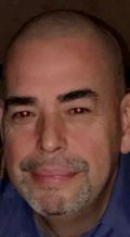 Close-up portrait of a bald man