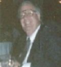 Portrait of a person in a dark suit