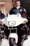 Portrait of a person with a white motorcycle