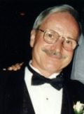 Portrait of a smiling man in a tuxedo
