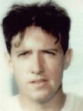 Portrait of a young person against a light background