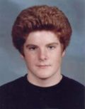 Portrait of a young person against a muted background