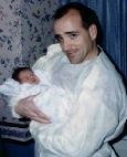 Portrait of an adult holding an infant